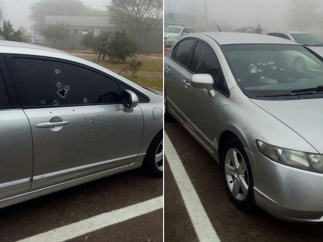 Marcas de tiros em carro de réu de homicídio morto nesta quinta-feira (28) no estacionamento do Fórum de Santa Maria, no Distrito Federal, pouco antes de início do julgamento (Foto: Polícia Militar/Divulgação).