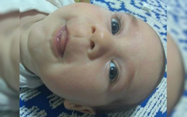 Bebê Michel, de 6 meses, que morreu com tiro no peito em Luziânia; pai foi preso suspeito do crime — Foto: Reprodução/TV Anhanguera.