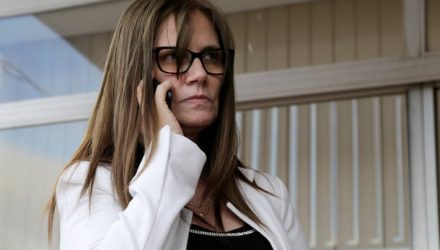 Attorney Laura Casuso uses her mobile phone at the airport in Luque, Paraguay December 28, 2017. Picture taken December 28, 2017. REUTERS/Jorge Adorno